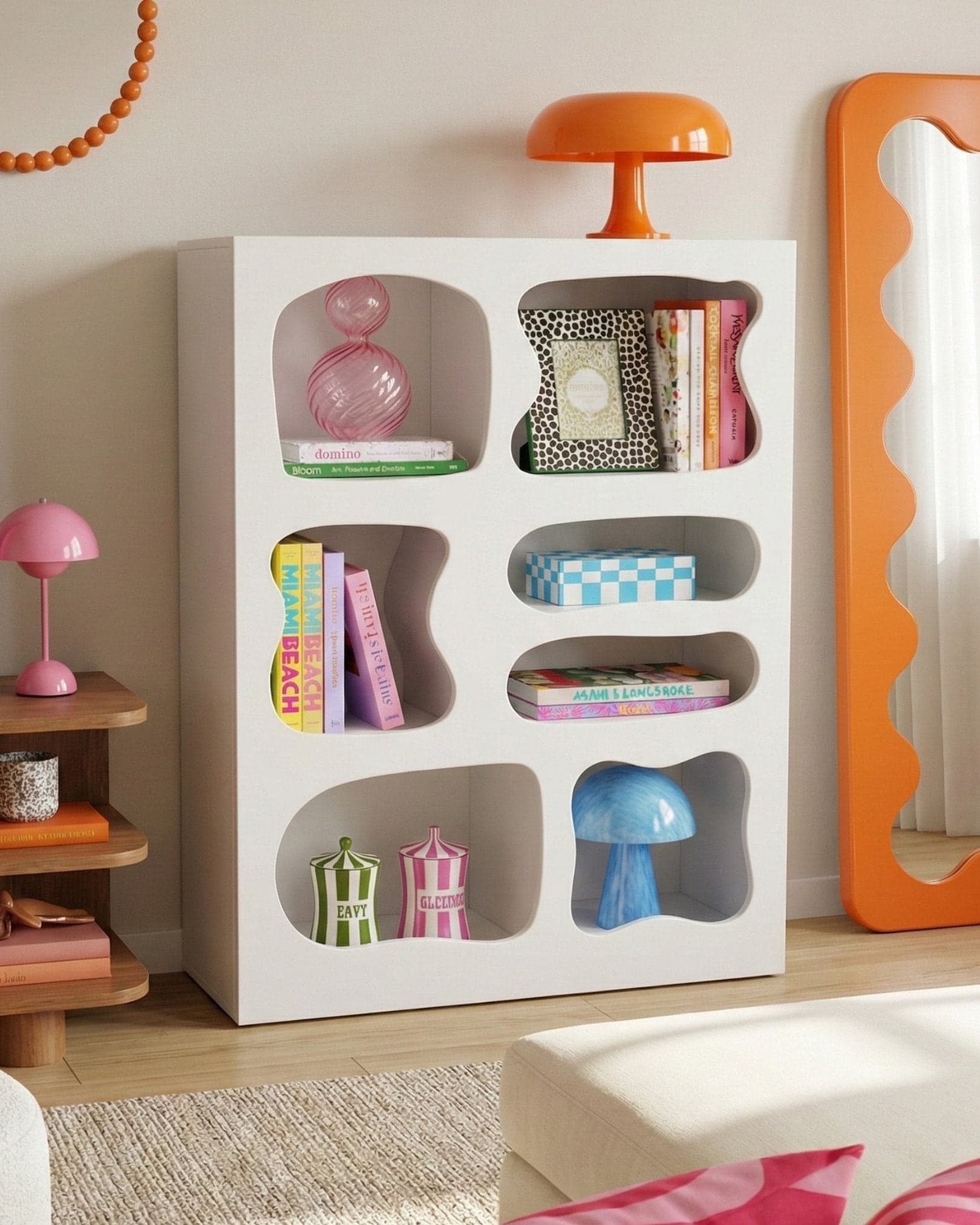 The Blob Rack LED Bookcase, styled with books and decor